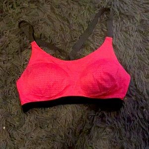 Thick grey straps a bright pink sports bra